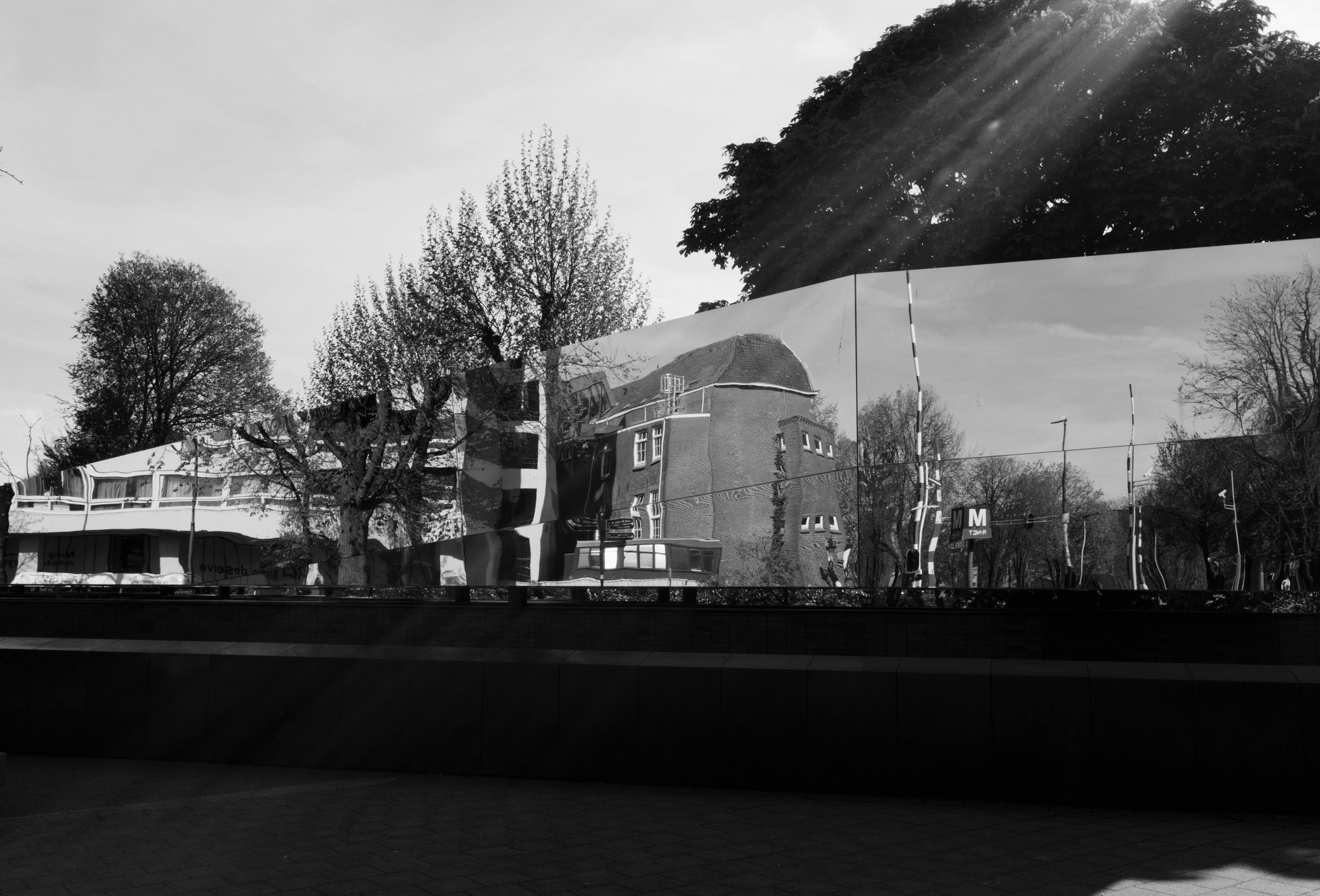 Architecture distorted across a mirrored building