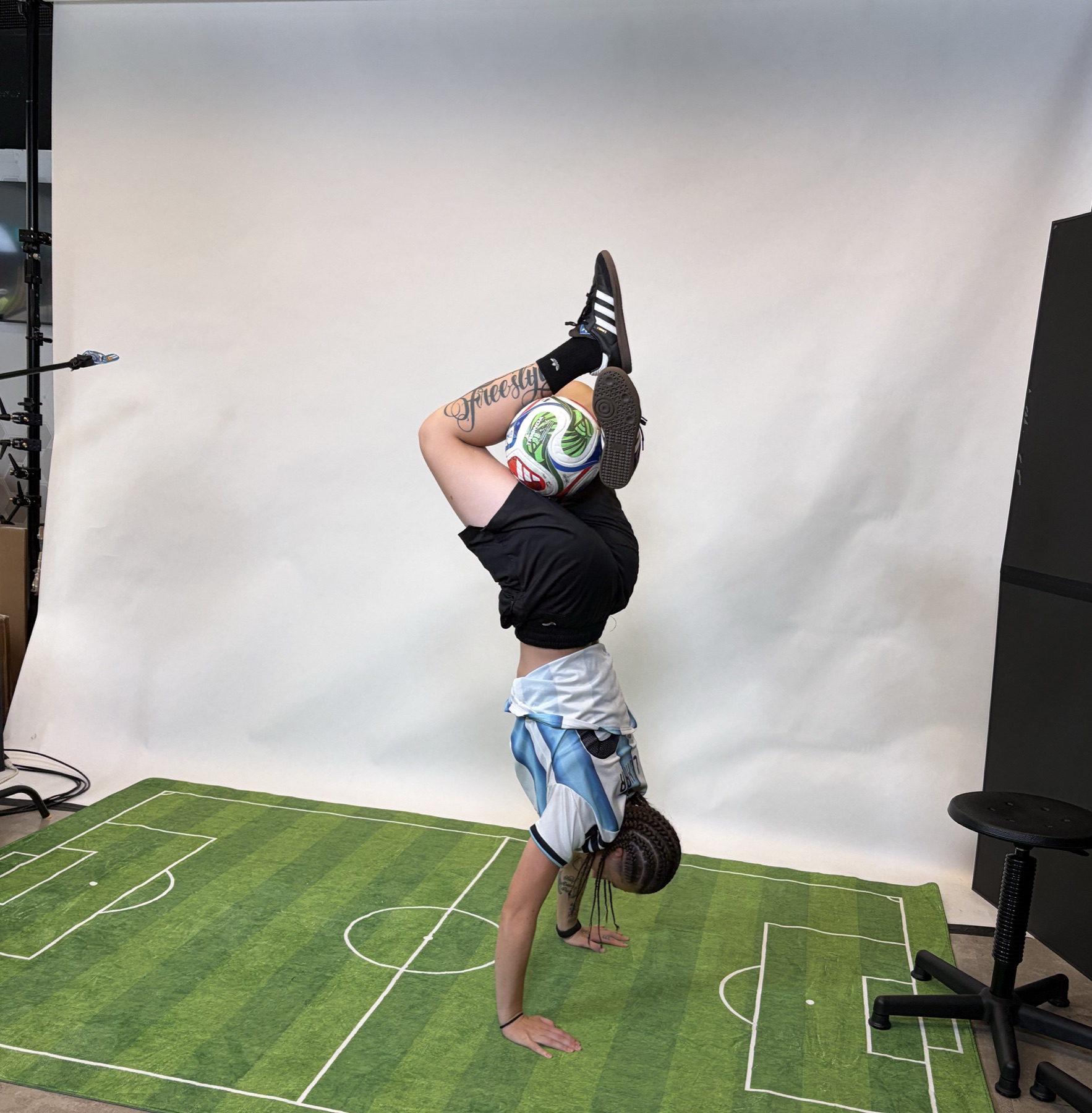 Football freestyler demonstrating with a soccer ball